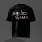 Black t-shirt with 'Squid Game' logo on a dark background