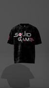 Black t-shirt with 'Squid Game' logo on a dark background