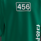Green t-shirt with number 456 and Korean text on a dark background